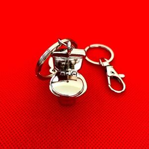 Yes this is a toilet seat bag charm/key chain!!!